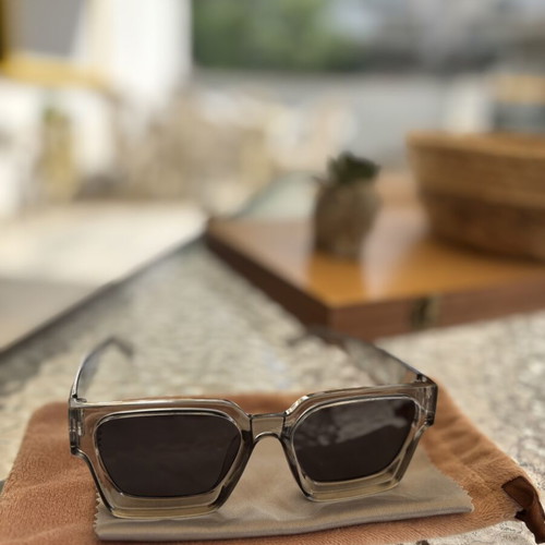 Sunglasses like new with gray semi-transparent frame, cloth and velvet case