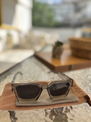 Sunglasses like new with gray semi-transparent frame, cloth and velvet case