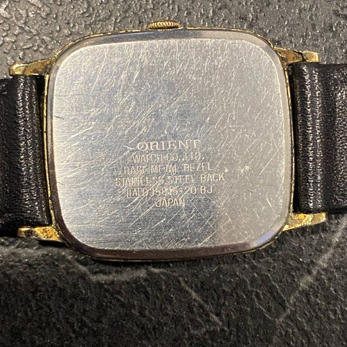 Orient VX used, needs battery, black and gold