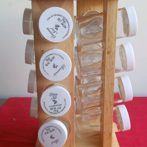 Spice jars used in wooden rotating rack with 16 glass containers