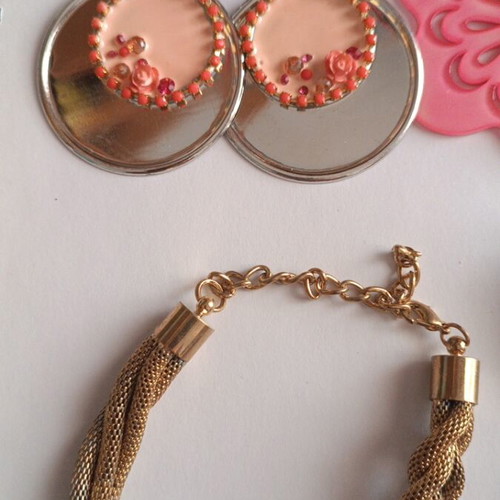 Jewelry set new with 3 pairs of pink earrings and gold bracelet
