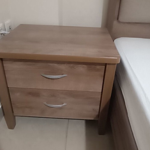 Wooden bedroom set with semi-double bed, nightstand, and chest of drawers