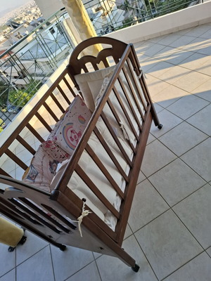 Wooden Baby Crib with Wheels and Protective Bumper, Walnut Color