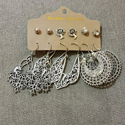 Set of six pairs of earrings new, three dangling and three small