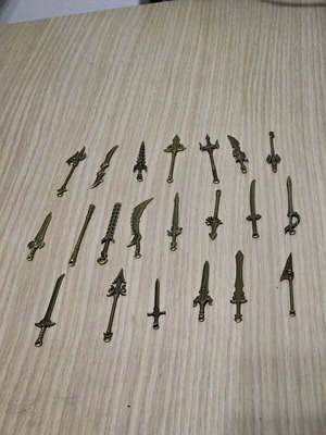 Metal miniature swords like new, set of 21
