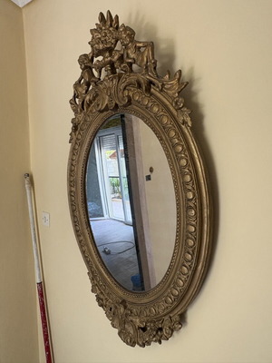 Baroque oval wall mirror with carved plaster frame, used, 104×61 cm
