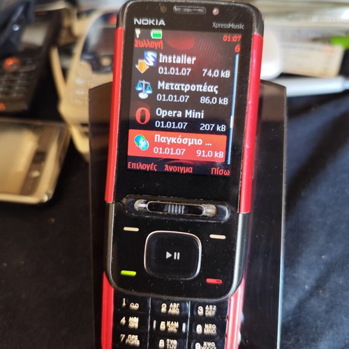Nokia 5610 XpressMusic phone used with charger