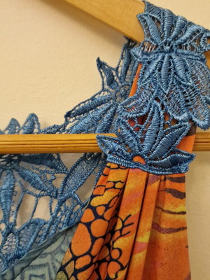 One-piece with patterns like new, size Medium, multicolored