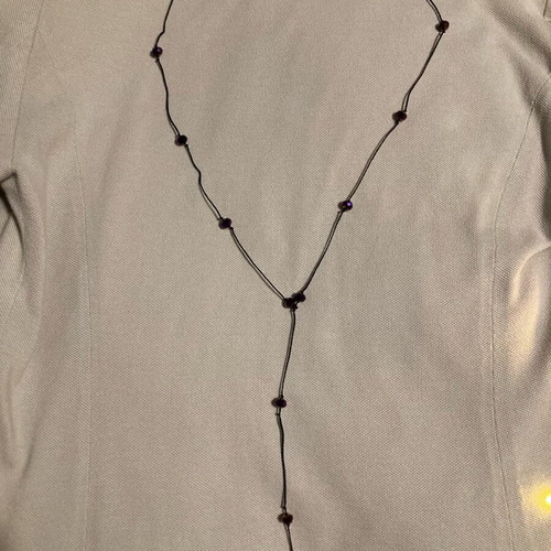 Necklace with purple beads like new, long with black cord