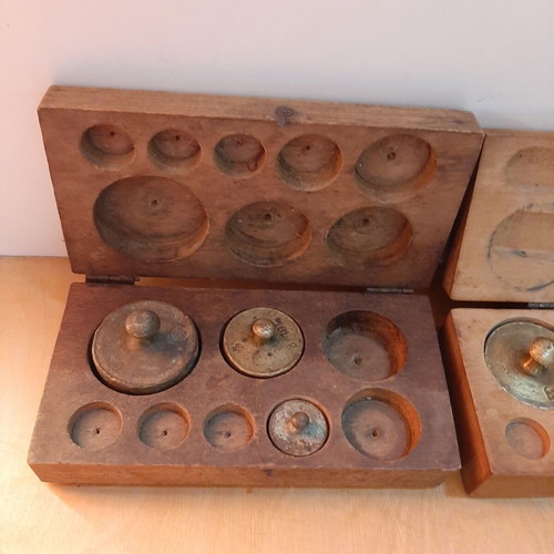 Wooden boxes with used bronze and cast iron scales set
