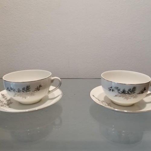 Tea cup set used with silver design, set of two