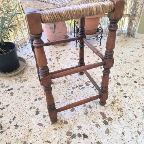 Vintage wicker stool used with wooden frame