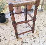 Vintage wicker stool used with wooden frame