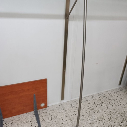 Stand with glass wall-mounted shelf used