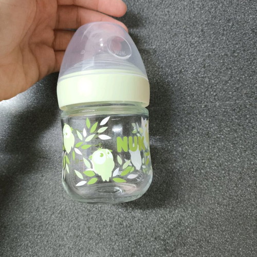 Small glass baby bottle like new with temperature indicator