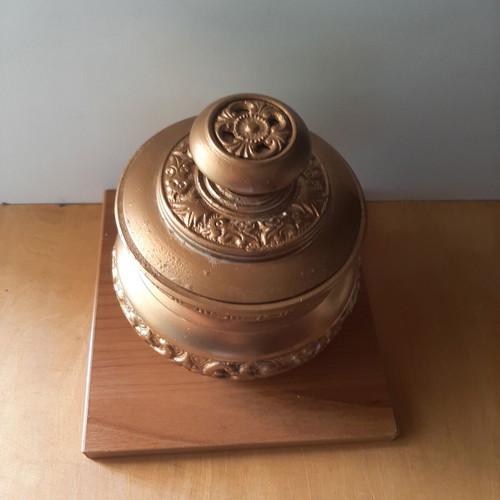 Vintage metal vessel with wooden base used, decorative aroma container