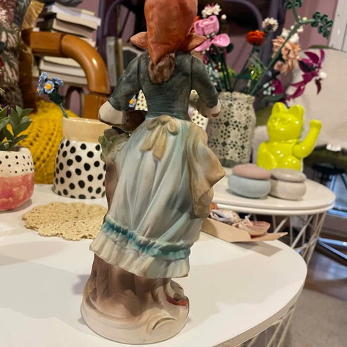 Porcelain decorative figurine of a girl with matte finish like new