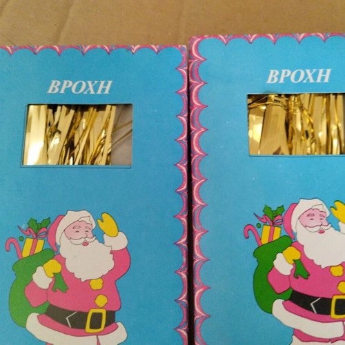 Vintage Christmas tinsel in red, gold and silver
