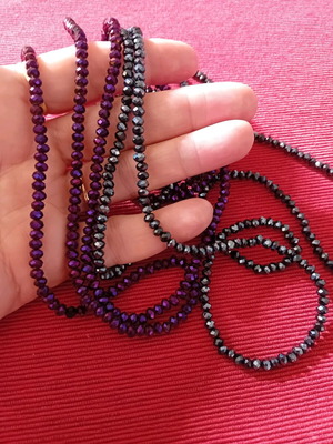Package. Two long necklaces, in two shades.