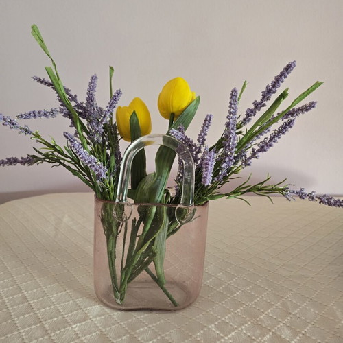 Glass vase with decorative flower arrangement