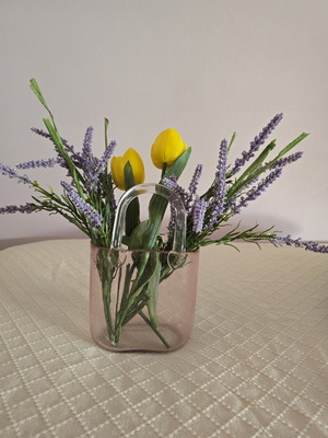 Glass vase with decorative flower arrangement
