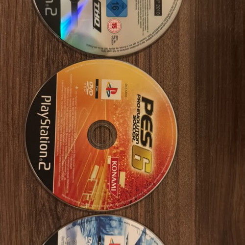 PlayStation 2 games pack of 3 used, Happy Feet, PES 6, WWE SmackDown vs. Raw 2010