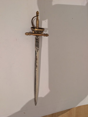 Vintage decorative letter opener in antique sword shape