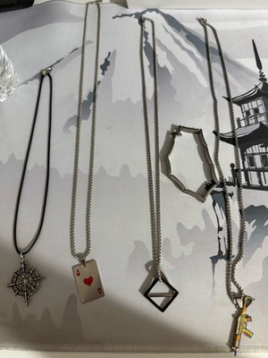 Necklaces and bracelet new with compass, playing card, shapes and gun