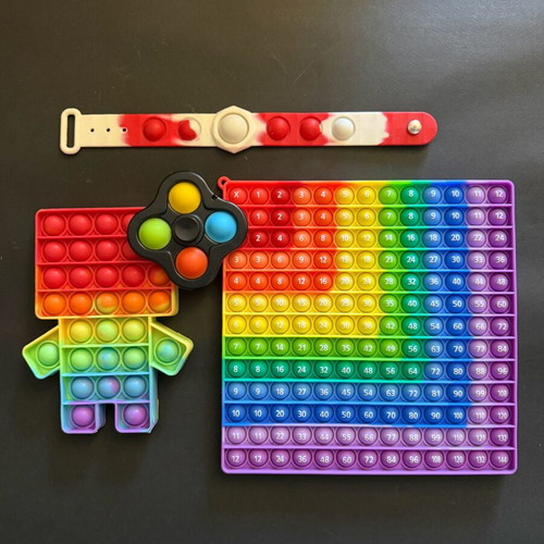 Set of 7 Pop It toys like new, includes multiplication learning