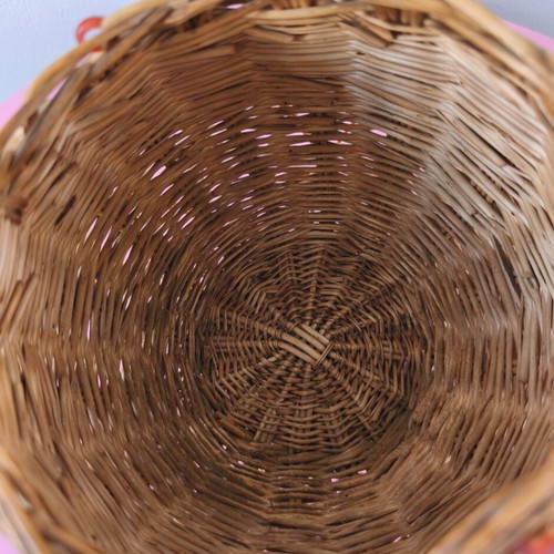 Handmade woven basket used with handle and decorative beads
