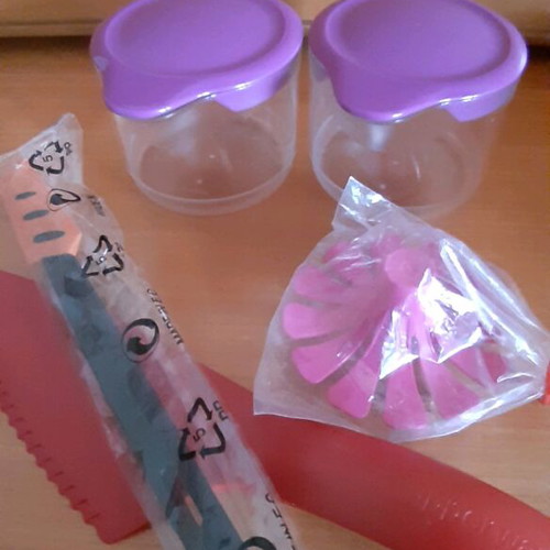 Tupperware product set new with collectible spatula and small cups