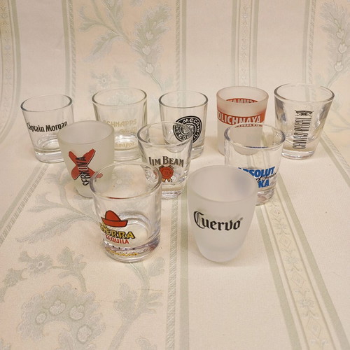 Collection of 87 shot glasses new, promotional and collectible