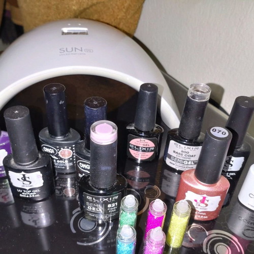 Sun nail lamp and 10 nearly full nail polishes