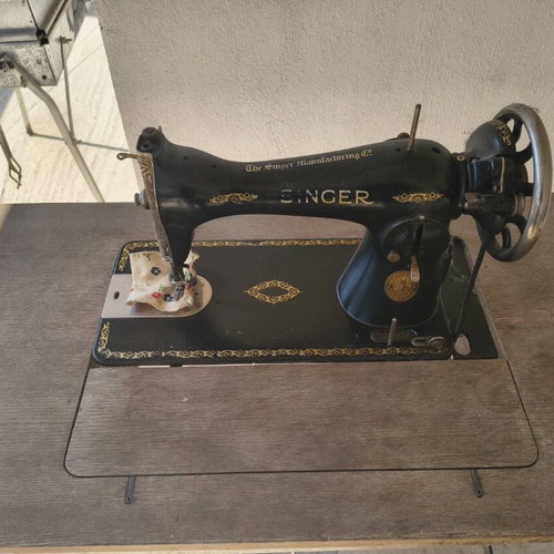 Singer vintage sewing machine used with original wooden table