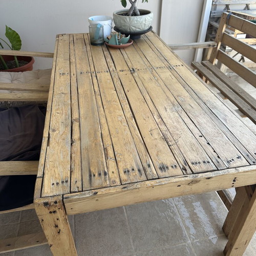 Handmade wooden table set with chairs and bench used
