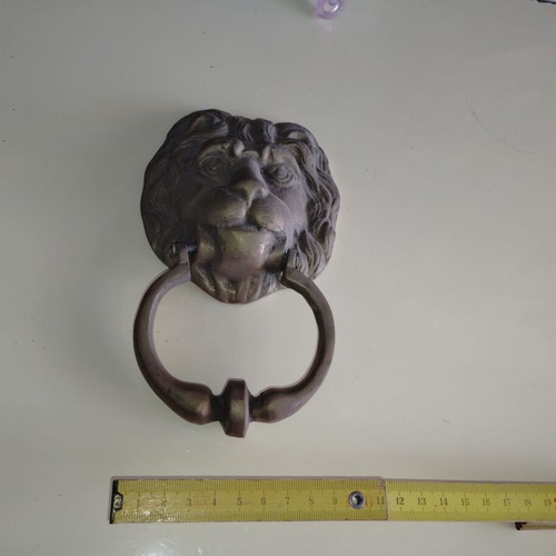 Lion door handle bronze old from old shop
