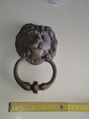 Lion door handle bronze old from old shop