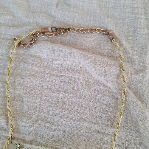 Handmade romantic necklace with lace in beige and gold tones