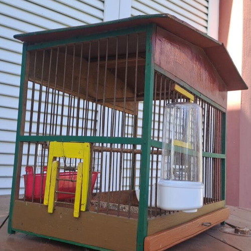 Handmade birdcage with feeder, waterer, nest, and egg holder