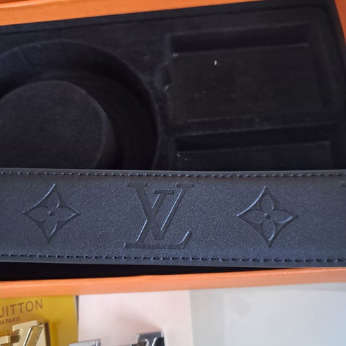 Louis Vuitton leather belt with interchangeable buckles