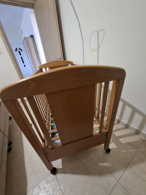 Baby cot made of solid wood with slats and drawer, like new