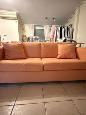 Sofa bed SATO used with two decorative pillows and throw