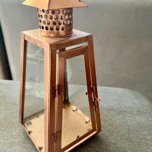 Metal candle lantern used, copper color