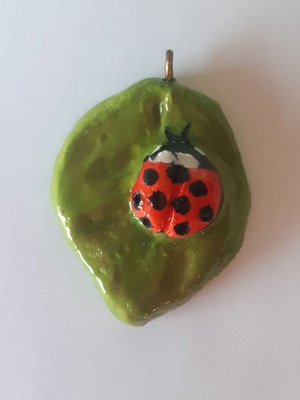 Ladybug pendant on leaf made of clay new, multicolor green