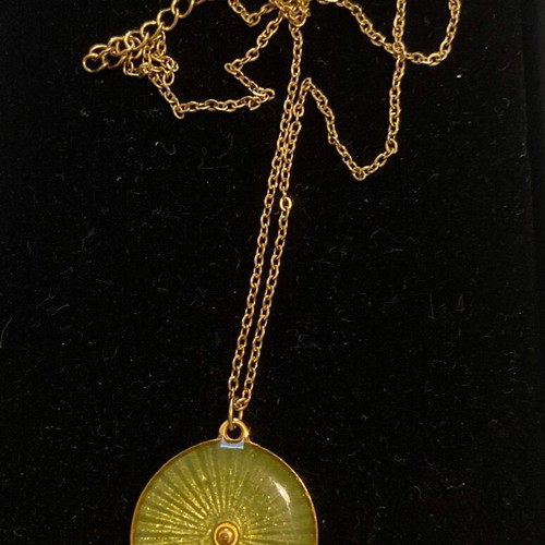 Necklace used, green-gold steel shield pendant