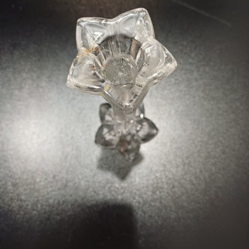 Tall crystal candlestick used with flower shape