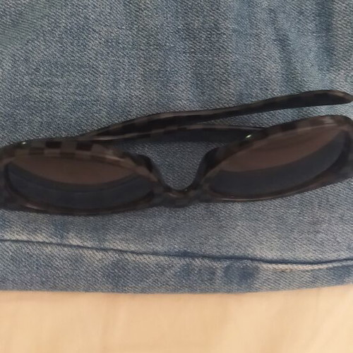 Vans sunglasses used with scratched lenses and slightly loose arms