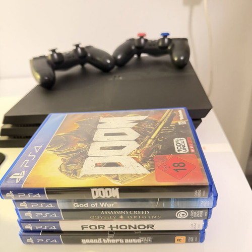 PlayStation 4 1TB like new, 2 consoles with 5 games