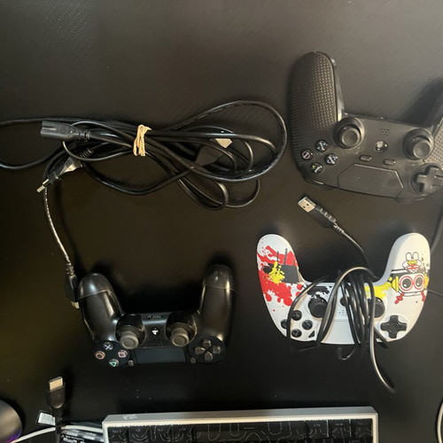 Sony PlayStation 4 Slim console used with 3 controllers and cables