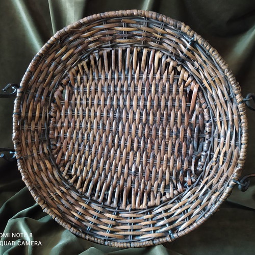 Woven rattan tray used with metal frame